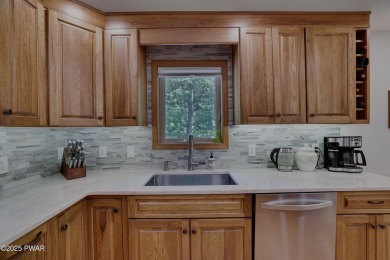Meticulously maintained log-sided lakefront on TinkWig Lake with on Woodloch Springs Country Club in Pennsylvania - for sale on GolfHomes.com, golf home, golf lot