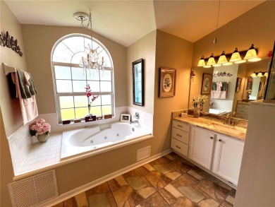 Beautiful home with a large Florida room overlooking a golf on Plantation Golf Club in Florida - for sale on GolfHomes.com, golf home, golf lot