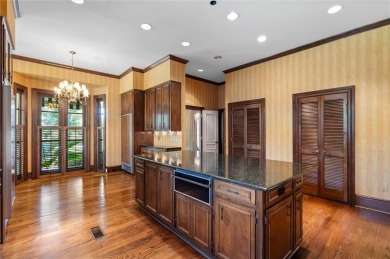 Situated on two lots with nearly an acre of land in one of the on Country Club of Mobile in Alabama - for sale on GolfHomes.com, golf home, golf lot