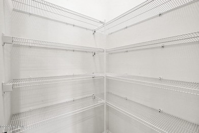 Welcome to your coastal sanctuary, where the tranquil shores of on Lockwood Folly Country Club in North Carolina - for sale on GolfHomes.com, golf home, golf lot