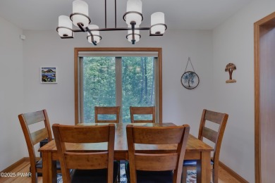 Meticulously maintained log-sided lakefront on TinkWig Lake with on Woodloch Springs Country Club in Pennsylvania - for sale on GolfHomes.com, golf home, golf lot