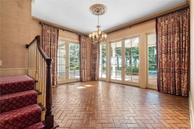 Situated on two lots with nearly an acre of land in one of the on Country Club of Mobile in Alabama - for sale on GolfHomes.com, golf home, golf lot