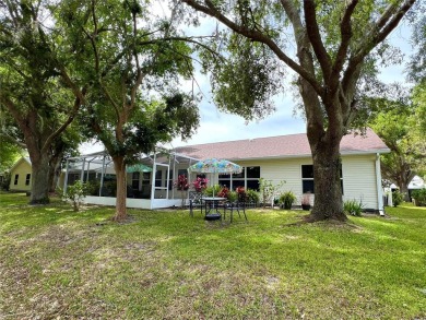Beautiful home with a large Florida room overlooking a golf on Plantation Golf Club in Florida - for sale on GolfHomes.com, golf home, golf lot