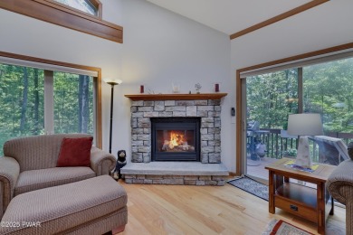 Meticulously maintained log-sided lakefront on TinkWig Lake with on Woodloch Springs Country Club in Pennsylvania - for sale on GolfHomes.com, golf home, golf lot