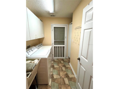 Beautiful home with a large Florida room overlooking a golf on Plantation Golf Club in Florida - for sale on GolfHomes.com, golf home, golf lot