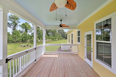 Welcome to your coastal sanctuary, where the tranquil shores of on Lockwood Folly Country Club in North Carolina - for sale on GolfHomes.com, golf home, golf lot