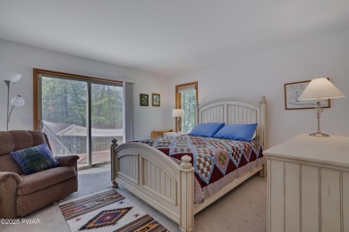Meticulously maintained log-sided lakefront on TinkWig Lake with on Woodloch Springs Country Club in Pennsylvania - for sale on GolfHomes.com, golf home, golf lot