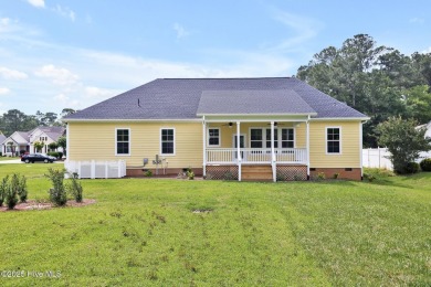 Welcome to your coastal sanctuary, where the tranquil shores of on Lockwood Folly Country Club in North Carolina - for sale on GolfHomes.com, golf home, golf lot