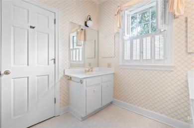 Situated on two lots with nearly an acre of land in one of the on Country Club of Mobile in Alabama - for sale on GolfHomes.com, golf home, golf lot