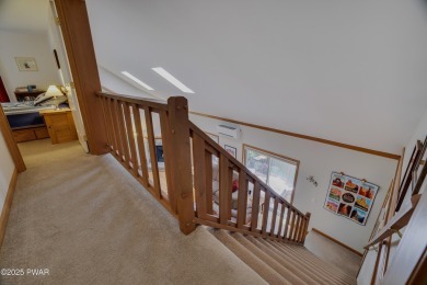 Meticulously maintained log-sided lakefront on TinkWig Lake with on Woodloch Springs Country Club in Pennsylvania - for sale on GolfHomes.com, golf home, golf lot