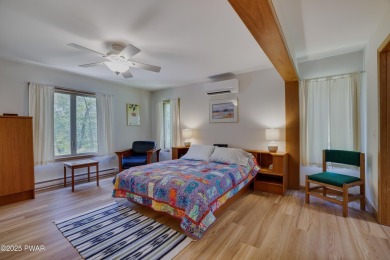 Meticulously maintained log-sided lakefront on TinkWig Lake with on Woodloch Springs Country Club in Pennsylvania - for sale on GolfHomes.com, golf home, golf lot