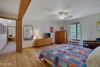 Meticulously maintained log-sided lakefront on TinkWig Lake with on Woodloch Springs Country Club in Pennsylvania - for sale on GolfHomes.com, golf home, golf lot