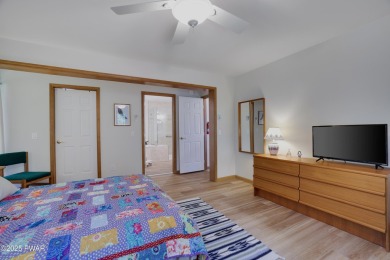 Meticulously maintained log-sided lakefront on TinkWig Lake with on Woodloch Springs Country Club in Pennsylvania - for sale on GolfHomes.com, golf home, golf lot