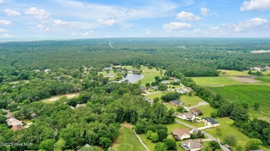 Welcome to your coastal sanctuary, where the tranquil shores of on Lockwood Folly Country Club in North Carolina - for sale on GolfHomes.com, golf home, golf lot