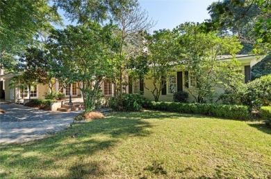 Situated on two lots with nearly an acre of land in one of the on Country Club of Mobile in Alabama - for sale on GolfHomes.com, golf home, golf lot