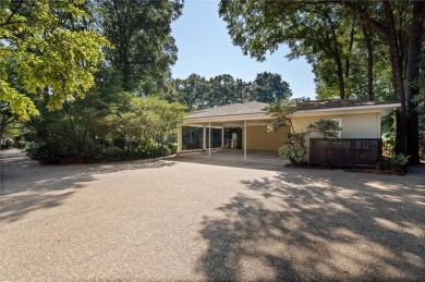 Situated on two lots with nearly an acre of land in one of the on Country Club of Mobile in Alabama - for sale on GolfHomes.com, golf home, golf lot