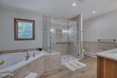 Meticulously maintained log-sided lakefront on TinkWig Lake with on Woodloch Springs Country Club in Pennsylvania - for sale on GolfHomes.com, golf home, golf lot