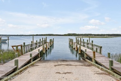 Welcome to your coastal sanctuary, where the tranquil shores of on Lockwood Folly Country Club in North Carolina - for sale on GolfHomes.com, golf home, golf lot