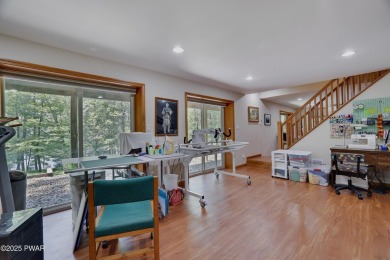 Meticulously maintained log-sided lakefront on TinkWig Lake with on Woodloch Springs Country Club in Pennsylvania - for sale on GolfHomes.com, golf home, golf lot