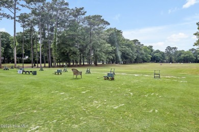 Welcome to your coastal sanctuary, where the tranquil shores of on Lockwood Folly Country Club in North Carolina - for sale on GolfHomes.com, golf home, golf lot