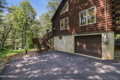 Meticulously maintained log-sided lakefront on TinkWig Lake with on Woodloch Springs Country Club in Pennsylvania - for sale on GolfHomes.com, golf home, golf lot
