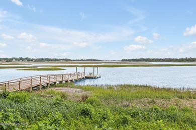 Welcome to your coastal sanctuary, where the tranquil shores of on Lockwood Folly Country Club in North Carolina - for sale on GolfHomes.com, golf home, golf lot