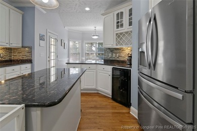 This beautiful home is located in the gated Gates Four community on Gates Four Golf and Country Club in North Carolina - for sale on GolfHomes.com, golf home, golf lot