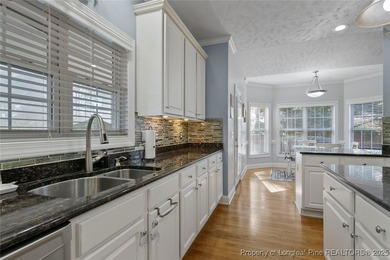 This beautiful home is located in the gated Gates Four community on Gates Four Golf and Country Club in North Carolina - for sale on GolfHomes.com, golf home, golf lot