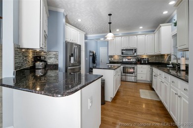 This beautiful home is located in the gated Gates Four community on Gates Four Golf and Country Club in North Carolina - for sale on GolfHomes.com, golf home, golf lot