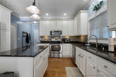 This beautiful home is located in the gated Gates Four community on Gates Four Golf and Country Club in North Carolina - for sale on GolfHomes.com, golf home, golf lot