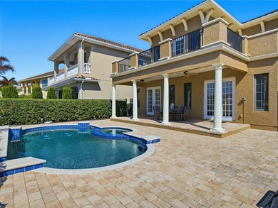 Wake up to golf course views and end your day poolside in this on ChampionsGate Golf Resort in Florida - for sale on GolfHomes.com, golf home, golf lot