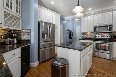 This beautiful home is located in the gated Gates Four community on Gates Four Golf and Country Club in North Carolina - for sale on GolfHomes.com, golf home, golf lot