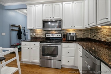 This beautiful home is located in the gated Gates Four community on Gates Four Golf and Country Club in North Carolina - for sale on GolfHomes.com, golf home, golf lot