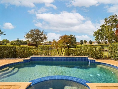 Wake up to golf course views and end your day poolside in this on ChampionsGate Golf Resort in Florida - for sale on GolfHomes.com, golf home, golf lot