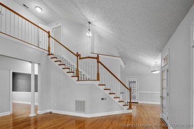 This beautiful home is located in the gated Gates Four community on Gates Four Golf and Country Club in North Carolina - for sale on GolfHomes.com, golf home, golf lot