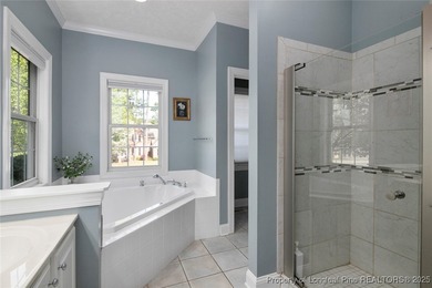 This beautiful home is located in the gated Gates Four community on Gates Four Golf and Country Club in North Carolina - for sale on GolfHomes.com, golf home, golf lot