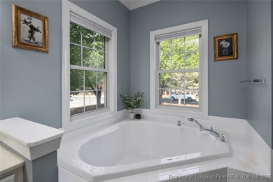 This beautiful home is located in the gated Gates Four community on Gates Four Golf and Country Club in North Carolina - for sale on GolfHomes.com, golf home, golf lot