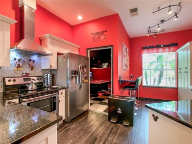 Turnkey 3 Bed, 2 Bath Mickey Mouse-Themed Pool Home in Ridgewood on Ridgewood Lakes Golf and Country Club in Florida - for sale on GolfHomes.com, golf home, golf lot