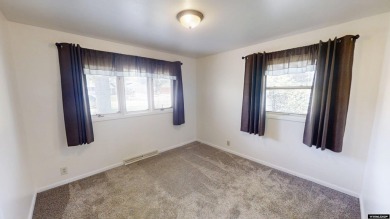 Welcome to this beautifully maintained Single-level home nestled on Paradise Valley Country Club in Wyoming - for sale on GolfHomes.com, golf home, golf lot