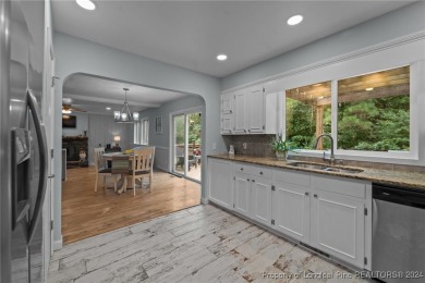 This fully updated home is nestled in a serene lake and golf on Seven Lakes Country Club in North Carolina - for sale on GolfHomes.com, golf home, golf lot