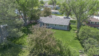 Welcome to this beautifully maintained Single-level home nestled on Paradise Valley Country Club in Wyoming - for sale on GolfHomes.com, golf home, golf lot