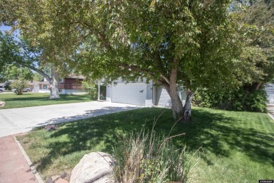 Welcome to this beautifully maintained Single-level home nestled on Paradise Valley Country Club in Wyoming - for sale on GolfHomes.com, golf home, golf lot