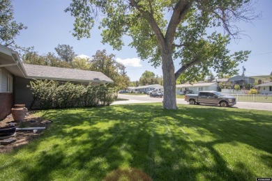 Welcome to this beautifully maintained Single-level home nestled on Paradise Valley Country Club in Wyoming - for sale on GolfHomes.com, golf home, golf lot