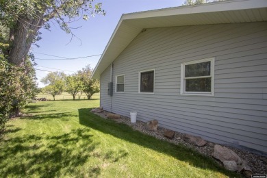 Welcome to this beautifully maintained Single-level home nestled on Paradise Valley Country Club in Wyoming - for sale on GolfHomes.com, golf home, golf lot