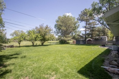 Welcome to this beautifully maintained Single-level home nestled on Paradise Valley Country Club in Wyoming - for sale on GolfHomes.com, golf home, golf lot