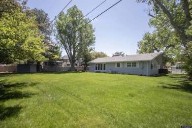 Welcome to this beautifully maintained Single-level home nestled on Paradise Valley Country Club in Wyoming - for sale on GolfHomes.com, golf home, golf lot