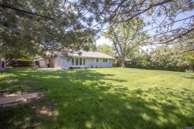Welcome to this beautifully maintained Single-level home nestled on Paradise Valley Country Club in Wyoming - for sale on GolfHomes.com, golf home, golf lot
