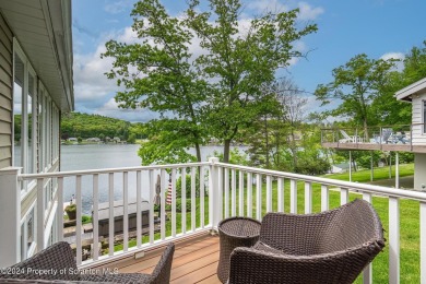 Indulge in the epitome of lakeside living with this exquisite on Scranton Canoe Club in Pennsylvania - for sale on GolfHomes.com, golf home, golf lot