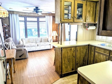This adorable mobile home is ready for its next owner! The home on River Run Golf Links in Florida - for sale on GolfHomes.com, golf home, golf lot