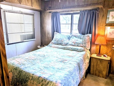 This adorable mobile home is ready for its next owner! The home on River Run Golf Links in Florida - for sale on GolfHomes.com, golf home, golf lot